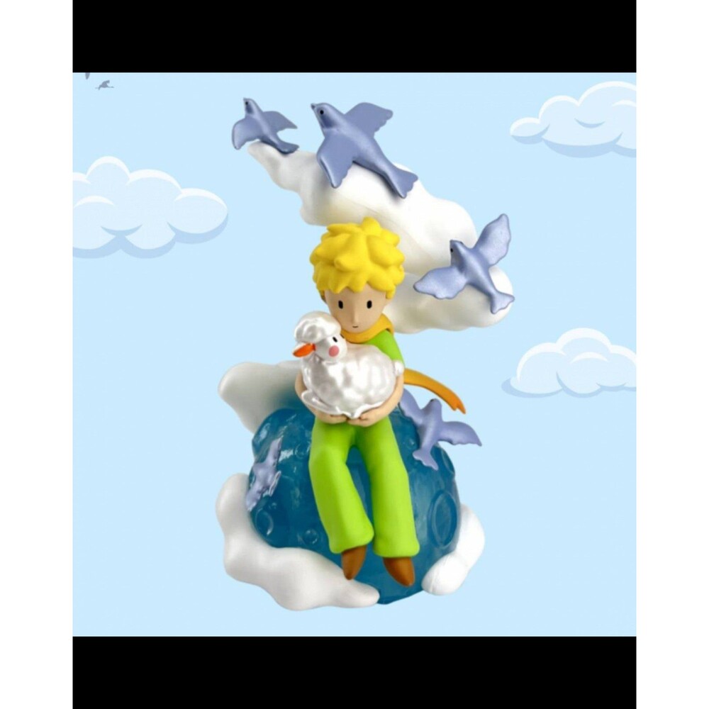 Le Petit prince and with a sheep figurine